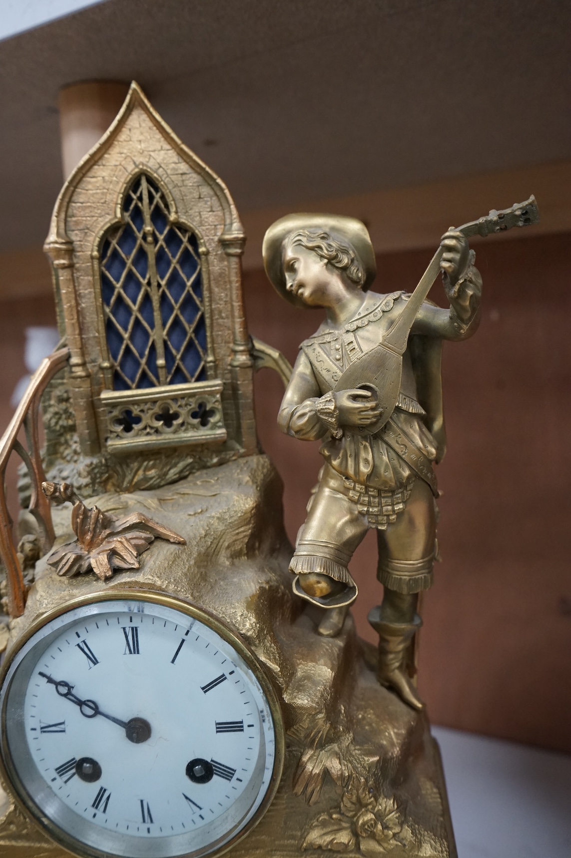 A late 19th century French gilt bronze mantel clock, with figural surmount, 42.5cm high.